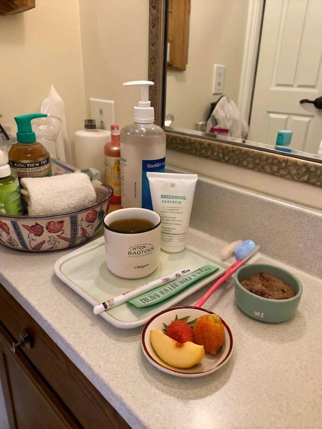 Self-care essentials including journal, tea, candle, and comfortable blanket
